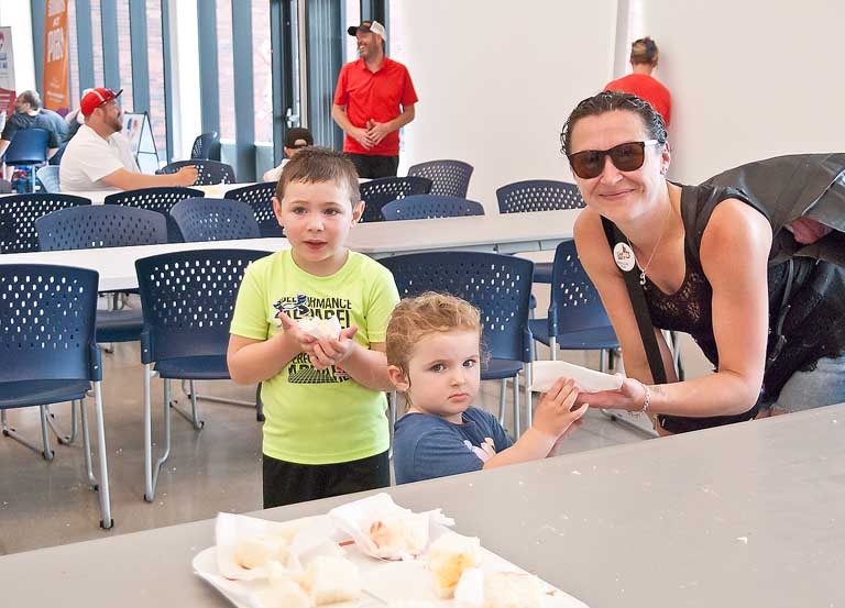 2-year-old Emma Cleaveley was happy to get one of the last pieces of birthday cake from mom, Jenny, she just wasn't as happy about having her photot taken as her 5-year-old brother, Noah was.