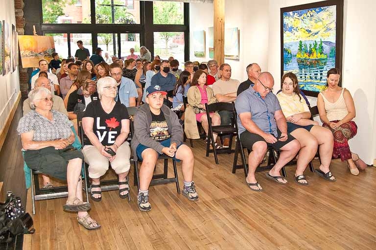 The audience for Sustainable Orillia's  2024 calendar - Biodiversity: It’s All Around Us award presentation at Creative Nomad Studio