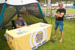 Friday at the Mariposa Folk Festival - Kevin Gangloff of the Orillia Youth Centre chatting with Dave Hewitt telling how his Canada Day set at the Aqua Theatre with Jakob Pearce ended and the fireworks exploded on the next beat.