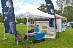 Friday at the Mariposa Folk Festival - John Winchester ready to meet festival goers at the Lightfoot Festival booth in Mariposa's Community Village