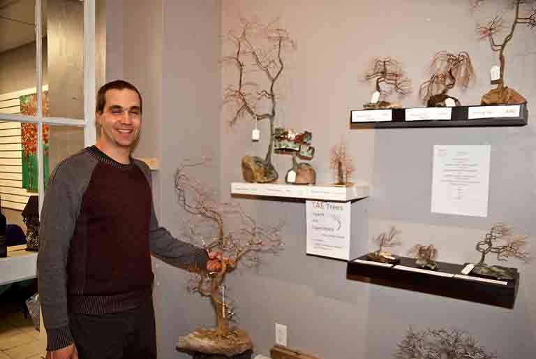 David Warner with his copper wire Bonsai tree sculptures at Art & Home Studio.