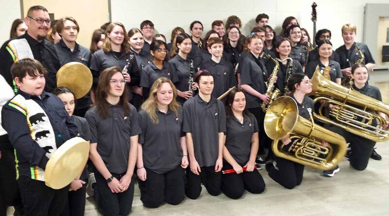 The Orillia Secondary School senior concert band with composer Brian Sarazin (left) at the premier of Nish Princess